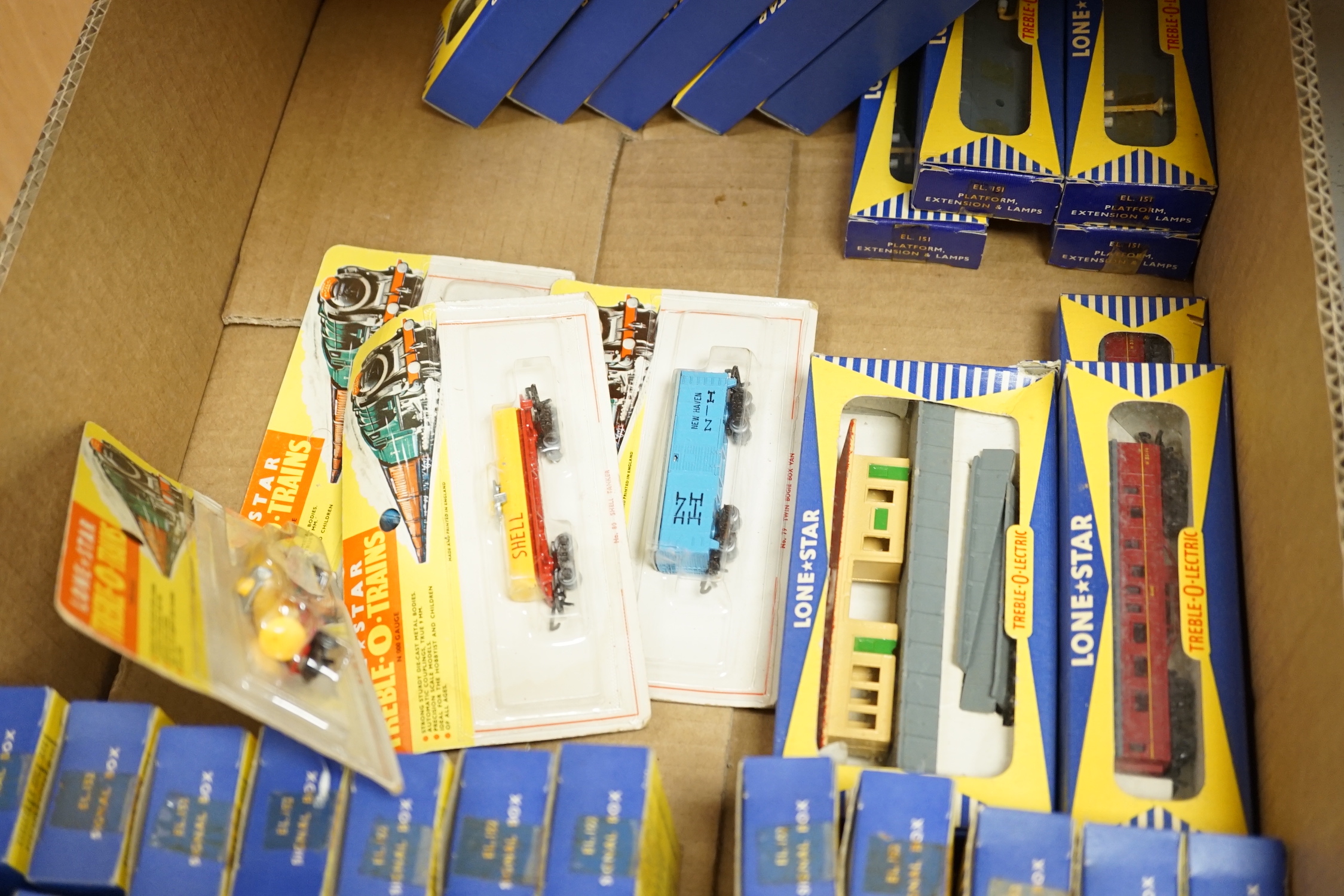 Sixty-two boxed items of Lone Star 000 gauge model railway including; a tunnel, Brake End Coaches, bogie wagons, station platforms, platform extensions, signal boxes, box vans, and telegraph poles